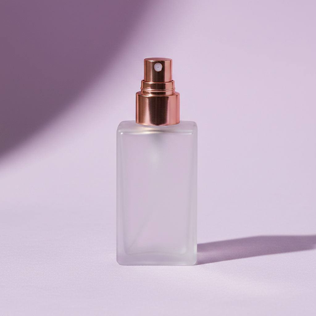 Lavender Mist setting spray in frosted glass bottle with rose gold nozzle on lavender background